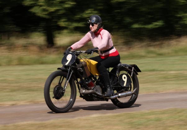 Judy Westacott on a Scott Flying Squirrel as The Vintage Speed Trials event is taking place at Grimsthorpe Castle in Lincolnshire. Featuring vintage cars and motorcycles it attracts hundreds of people to show off their vehicles, and many wear attire from the pre-war period. Vintage Speed Trials, Grimsthorpe Castle, Lincolnshire, on 4th July, 2026.  .