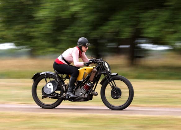 Judy Westacott on a Scott Flying Squirrel as The Vintage Speed Trials event is taking place at Grimsthorpe Castle in Lincolnshire. Featuring vintage cars and motorcycles it attracts hundreds of people to show off their vehicles, and many wear attire from the pre-war period. Vintage Speed Trials, Grimsthorpe Castle, Lincolnshire, on 4th July, 2026.  .