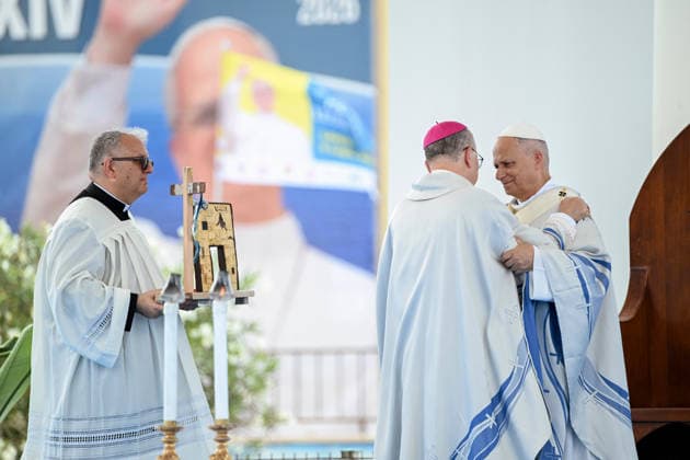 Pope Leo XIV visits the Southern Italian island of Lampedusa LAMPEDUSA, ITALY - JULY 04: Alessandro Damiano, Archbishop of Agrigento seen giving a gift to Pope Leo XIV (R) in Lampedusa, Italy, on July 04, 2026. Pope Leo XIV arrived in Lampedusa to rise attention to the migrant issue and the unique position of the island. During his visit he met with a group of migrants, accompanied by the Red Cross at Favaloro Pier, inaugurating a new plaque with the new name of the Pier dedicated to Pope Francis. Later nearly 4000 people gathered in the sport field to attend the homily celebrated by the Pope. Valeria Ferraro Anadolu Lampedusa Italy. Editorial use only. Please get in touch for any other usage.  Copyright: x2026xAnadoluxValeriaxFerrarox