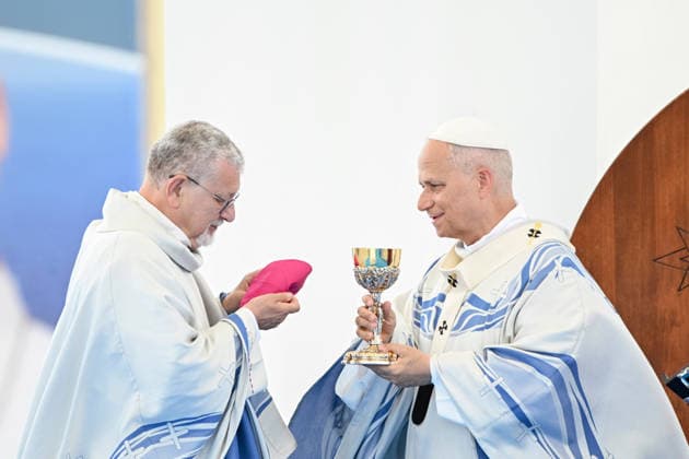 Pope Leo XIV visits the Southern Italian island of Lampedusa LAMPEDUSA, ITALY - JULY 04: Alessandro Damiano, Archbishop of Agrigento (L) seen exchanging gifts with the Pope (R) in Lampedusa, Italy, on July 04, 2026. Pope Leo XIV arrived in Lampedusa to rise attention to the migrant issue and the unique position of the island. During his visit he met with a group of migrants, accompanied by the Red Cross at Favaloro Pier, inaugurating a new plaque with the new name of the Pier dedicated to Pope Francis. Later nearly 4000 people gathered in the sport field to attend the homily celebrated by the Pope. Valeria Ferraro Anadolu Lampedusa Italy. Editorial use only. Please get in touch for any other usage.  Copyright: x2026xAnadoluxValeriaxFerrarox