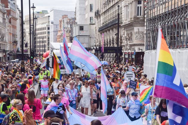 July 4, 2026, London, England, United Kingdom: Participants holding Trans Pride flags pass through Piccadilly during the Pride In London parade. London United Kingdom - ZUMAv130 20260704_zip_v130_024 Copyright: xVukxValcicx
