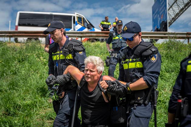 July 4, 2026, Utrecht, Utrecht, Netherlands: 4 July 2026, Utrecht, the Netherlands. Dutch police arrest climate activists attempting to block a major Dutch highway. Climate activists from Extinction Rebellion and Utrecht for Palestine block the A12 highway near Utrecht, Netherlands, demanding an end to billions in annual fossil fuel subsidies. Utrecht Netherlands  - ZUMAp202 20260704_zip_p202_010 Copyright: xJamesxPetermeierx