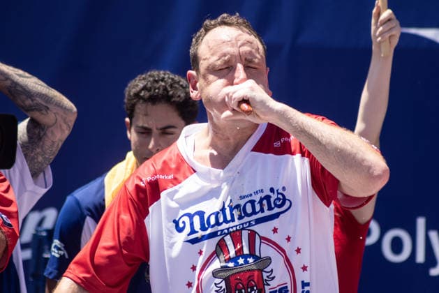 Joey Chestnut competes in the 110th Nathan s Famous Fourth of July International Hot Dog Eating Contest on Independence Day, Saturday, July 4, 2026 on Coney Island in New York City. Joey Chestnut won the championship and retains his title eating 70 hot dogs and buns.  NYP20260704803 JONATHANxFERNANDEZ