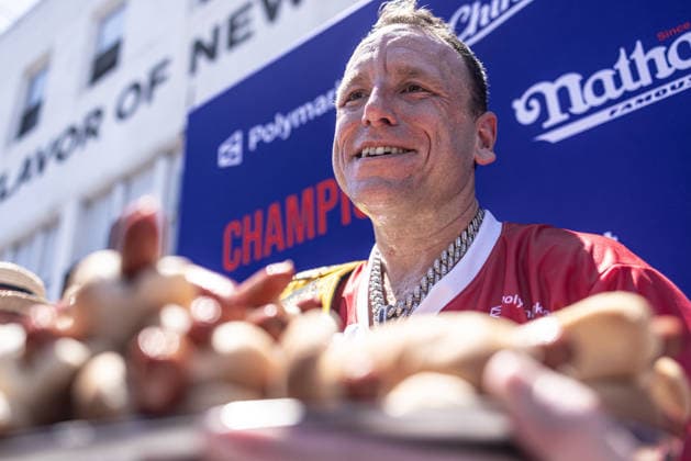 Joey Chestnut competes in the 110th Nathan s Famous Fourth of July International Hot Dog Eating Contest on Independence Day, Saturday, July 4, 2026 on Coney Island in New York City. Joey Chestnut won the championship and retains his title eating 70 hot dogs and buns.  NYP20260704807 JONATHANxFERNANDEZ