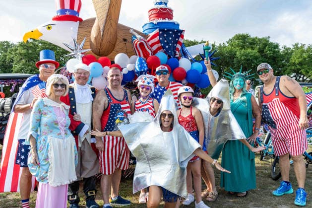 July 4, 2026, Sullivans Island, Sc, United States of America: Costumed participants pose by their patriotic themed golf cart float before the start of the annual Bicycle and Golf cart parade celebrating the 250th Independence Day, July 4, 2026 in Sullivans Island, South Carolina. Like most of the nation, South Carolina is under a heat dome with dangerously hot, humid weather. Sullivans Island United States of America  - ZUMAe02_ 20260704_zaf_e02_027 Copyright: xRichardxEllisx
