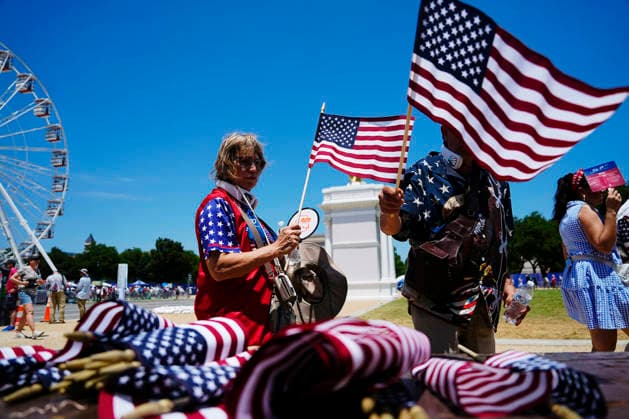 Visitors to the Great American State Fair on the National Mall pick out flags to celebrate America s 250th anniversary in Washington DC on Saturday, July 4, 2026.  WAP20260704502 BONNIExCASH