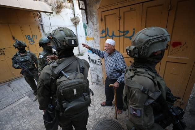 HEBRON, WEST BANK JULY 4, 2026: Israeli settlers enter the Old City of Hebron under the protection of Israeli security forces during a weekly organized visit. The visits, which take place under military escort, are opposed by many Palestinian residents and are a recurring source of tension in the city. HEBRON Palestine, State of Copyright: x xMosabxshawerx xJNAxPressx
