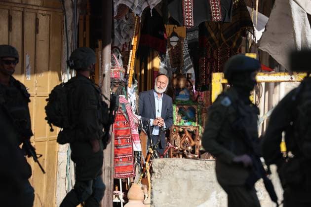 HEBRON, WEST BANK JULY 4, 2026: Israeli settlers enter the Old City of Hebron under the protection of Israeli security forces during a weekly organized visit. The visits, which take place under military escort, are opposed by many Palestinian residents and are a recurring source of tension in the city. HEBRON Palestine, State of Copyright: x xMosabxshawerx xJNAxPressx