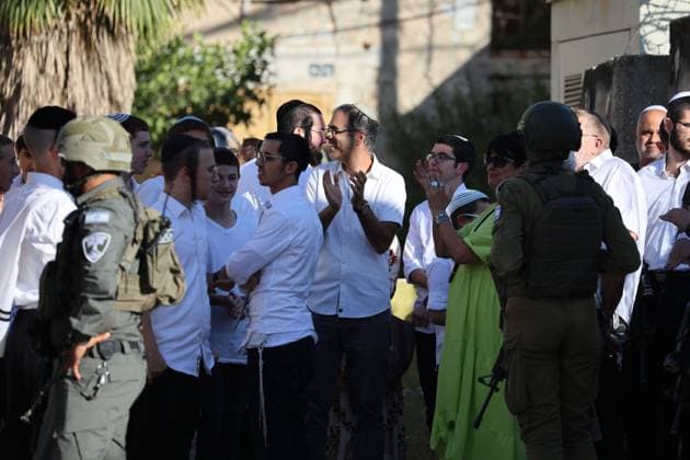 HEBRON, WEST BANK JULY 4, 2026: Israeli settlers enter the Old City of Hebron under the protection of Israeli security forces during a weekly organized visit. The visits, which take place under military escort, are opposed by many Palestinian residents and are a recurring source of tension in the city. HEBRON Palestine, State of Copyright: x xMosabxshawerx xJNAxPressx