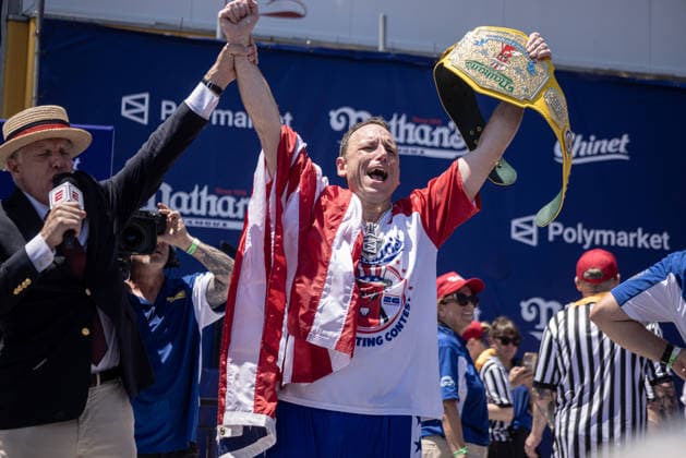 Joey Chestnut competes in the 110th Nathan s Famous Fourth of July International Hot Dog Eating Contest on Independence Day, Saturday, July 4, 2026 on Coney Island in New York City. Joey Chestnut won the championship and regains his title eating 70 hot dogs and buns.  NYP2026070480115 JONATHANxFERNANDEZ