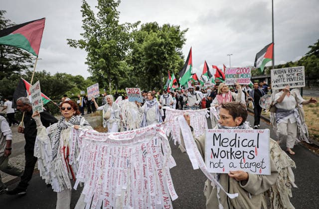 July 4, 2026, Berlin, Berlin, Germany: Berlin, Germany, July 4, 2026: Demonstrators take part in a pro-Palestinian march through central Berlin calling for an end to the war in Gaza, protection of medical workers, and the release of detained Palestinian doctor Hussam Abu Safiya. Participants carried Palestinian flags, banners and photographs during the demonstration. ZUMA Press Wire. Berlin Germany - ZUMAa268 20260704_zip_a268_001 Copyright: xAbdelrahmanxAlkahloutx
