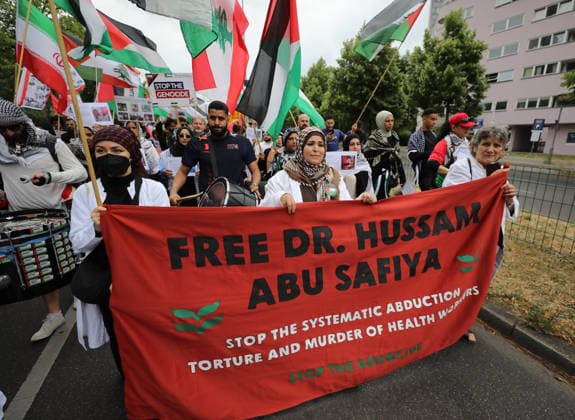 July 4, 2026, Berlin, Berlin, Germany: Berlin, Germany, July 4, 2026: Demonstrators take part in a pro-Palestinian march through central Berlin calling for an end to the war in Gaza, protection of medical workers, and the release of detained Palestinian doctor Hussam Abu Safiya. Participants carried Palestinian flags, banners and photographs during the demonstration. ZUMA Press Wire. Berlin Germany - ZUMAa268 20260704_zip_a268_004 Copyright: xAbdelrahmanxAlkahloutx