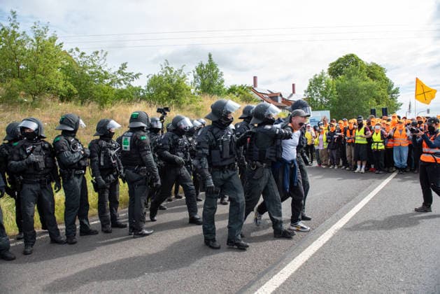 Mass demonstrations accompany AfD party congress in eastern Germany ERFURT, GERMANY - JULY 04: Police take measures as protesters take part in coordinated civil disobedience actions during demonstrations against the federal party congress of the Alternative for Germany (AfD) in Erfurt, Germany, on July 4, 2026. Around 8:30 a.m., demonstrators established multiple blockades on roads leading to the Messe Erfurt exhibition grounds, with organizers reporting tens of thousands of participants attempting to hinder delegates from reaching the congress venue. More than 5,000 police officers were deployed from across Germany to secure the event and clear access routes. The AfD is a right-wing populist political party and one of Germany’s largest opp  Copyright: x2026xAnadoluxMouafakxMahmaljix