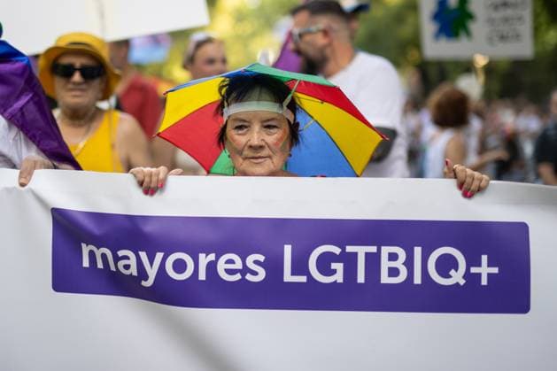 July 4, 2026, Madrid, Madrid, Spain: A woman behind a banner with the slogan LGBTIQ+ seniors participates in MADO 2026 on a street in downtown Madrid..Celebration of MADO, annual LGBT Pride parade through the center of Madrid, one of the largest and most important in Europe. Madrid Spain  - ZUMAs197 20260704_aaa_s197_166 Copyright: xSOPAxImagesx