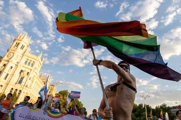July 4, 2026, Madrid, Madrid, Spain: A man carries a rainbow flag during MADO 2026 on a street in downtown Madrid..Celebration of MADO, annual LGBT Pride parade through the center of Madrid, one of the largest and most important in Europe. Madrid Spain - ZUMAs197 20260704_aaa_s197_170 Copyright: xSOPAxImagesx