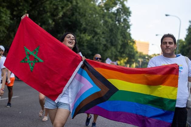 July 4, 2026, Madrid, Madrid, Spain: A protester (L) carries a Moroccan flag during MADO 2026 on a street in downtown Madrid..Celebration of MADO, annual LGBT Pride parade through the center of Madrid, one of the largest and most important in Europe. Madrid Spain - ZUMAs197 20260704_aaa_s197_179 Copyright: xSOPAxImagesx