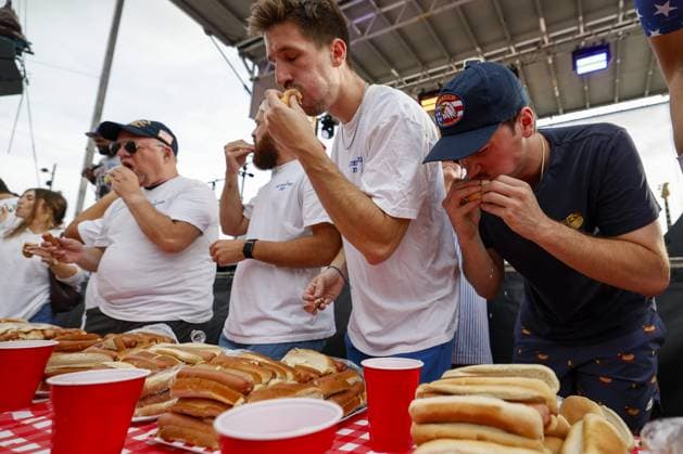 July 4, 2026, Tampa, Florida, USA: Contestants compete to a crowd of hundreds at the Where my Dogs at? Hot Dog Eating Contest at Armature Works part of the Liberty By The Bay citywide celebration on Saturday, July 4, 2026 in Tampa. Tampa USA - ZUMAs70_ 20260704_zan_s70_008 Copyright: xLuisxSantanax