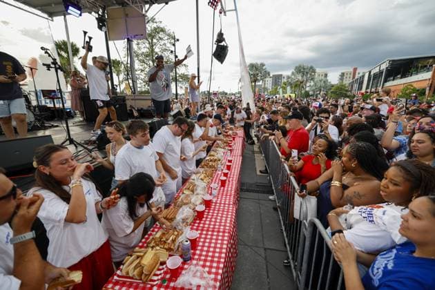 July 4, 2026, Tampa, Florida, USA: Contestants compete to a crowd of hundreds at the Where my Dogs at? Hot Dog Eating Contest at Armature Works part of the Liberty By The Bay citywide celebration on Saturday, July 4, 2026 in Tampa. Tampa USA - ZUMAs70_ 20260704_zan_s70_010 Copyright: xLuisxSantanax
