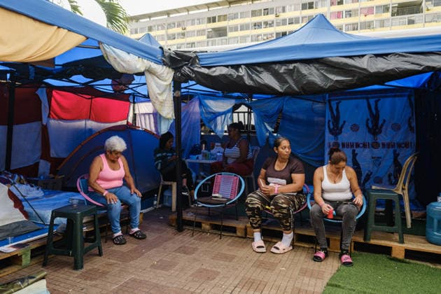 Evacuation of Venezuelan families continue after twin earthquakes CARACAS, VENEZUELA - JULY 4: Displaced Venezuelan families adjust to life inside temporary makeshift camps set up along the central Avenida Bolívar, near local museums, in Caracas, Venezuela, on July 4, 2026. Following the twin earthquakes, residents living in the state-subsidized Mision Vivienda housing complexes were urgently evacuated due to safety concerns. As emergency command continue processing requests for technical inspections, the displaced citizens await engineering assessments to determine whether their apartments are structurally sound for a safe return. Diko Betancourt Anadolu Caracas Venezuela. Editorial use only. Please get in touch for any other usage.  Copyright: x2026xAnadoluxDikoxBetancourtx
