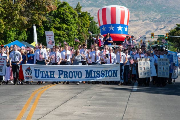 July 4, 2026, Provo, Utah, USA: Missionaries from The Church of Jesus Christ of Latter-day Saints wear black name badges and wave American flags while marching down the street during America s Freedom Festival Grand Parade in Provo, Utah, Saturday, July 4, 2026. The annual Independence Day event features expanded programming to honor the 250th anniversary of United States independence. Provo USA  - ZUMAm292 20260704_znp_m292_050 Copyright: xCharlesxMcClintockxWilsonx