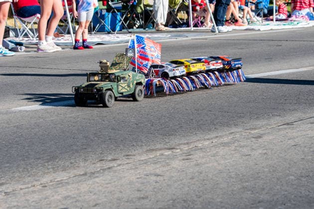 July 4, 2026, Provo, Utah, USA: A remote-controlled pickup truck decorated with small American flags tows a trailer carrying a second RC vehicle down the street during America s Freedom Festival Grand Parade in Provo, Utah, Saturday, July 4, 2026. The annual Independence Day event features expanded programming to honor the 250th anniversary of United States independence. Provo USA - ZUMAm292 20260704_znp_m292_124 Copyright: xCharlesxMcClintockxWilsonx