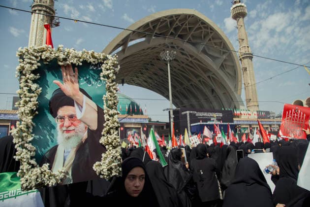 Tehran Iran Khamenei Funeral July 4 A mourner carries a framed portrait of Iran s late Supreme Leader Ayatollah Ali Khamenei decorated with flowers during his funeral ceremony in the courtyard of the Imam Khomeini Grand Mosalla in Tehran, Iran, on July 4, 2026. Ayatollah Khamenei and members of his family were killed on February 28 in a U.S.-Israeli airstrike during the first day of a military campaign against the Islamic Republic. The attack brought an end to his 36-year rule, leading to a six-day multi-city state funeral and drawing thousands of mourners to pay their final respects. Tehran Tehran Iran Copyright: xHosseinxBerisx