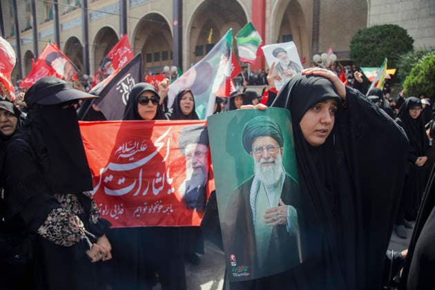 Tehran Iran Khamenei Funeral July 4 A mourner holds her head and a portrait of Iran s late Supreme Leader Ayatollah Ali Khamenei during his funeral ceremony in the courtyard of the Imam Khomeini Grand Mosalla in Tehran, Iran, on July 4, 2026. Ayatollah Khamenei and members of his family were killed on February 28 in a U.S.-Israeli airstrike during the first day of a military campaign against the Islamic Republic. The attack brought an end to his 36-year rule, leading to a six-day multi-city state funeral and drawing thousands of mourners to pay their final respects. Tehran Tehran Iran Copyright: xHosseinxBerisx