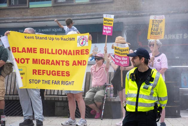 Far-right demo and antifascist counter-protest in Dover, UK - 04 Jul 2026 Antifascist counter-protesters hold a banner during a demonstration in Dover. Around 100-120 supporters of the Pink Ladies gathered from across the country in Dover, UK. The Pink Ladies is an anti immigration far-right movement. The far-right activists marched through central Dover to the Immigration Centre and they were confronted by a small group of antifascist counter-protesters during their march. Dover United Kingdom Copyright: xKrisztianxElekx xSOPAxImagesx SSS_20260704_FAR_RIGHT_0011005001