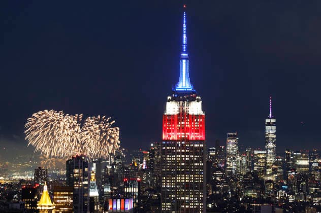 The Empire State Building is lit in red, white and blue as the Macy s 4th of July fireworks light up the night sky as part of the celebration of America s 250th anniversary as seen From the Top of the Rock Observation Deck at Rockefeller Center in New York City on Saturday, July 4, 2026.  NYP20260704954 JOHNxANGELILLO