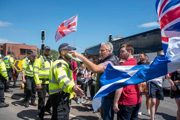 Far-right demo and antifascist counter-protest in Dover, UK - 04 Jul 2026 A far-right protester shouts at the antifascists during a demonstration in Dover. Around 100-120 supporters of the Pink Ladies gathered from across the country in Dover, UK. The Pink Ladies is an anti immigration far-right movement. The far-right activists marched through central Dover to the Immigration Centre and they were confronted by a small group of antifascist counter-protesters during their march. Dover United Kingdom Copyright: xKrisztianxElekx xSOPAxImagesx SSS_20260704_FAR_RIGHT_0011005058