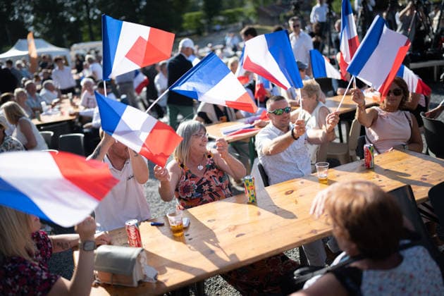 Marine Le Pen and Jordan Bardella at the RN party event La fete champetre - Lievin AJ This photo is an illustration of a participant holds French flags during a RN party event La fete champetre in Lievin, northern France on July 4, 2026. Photo by Alexis Jumeau ABACAPRESS.COM. Paris France  Copyright: xJumeauxAlexis ABACAx