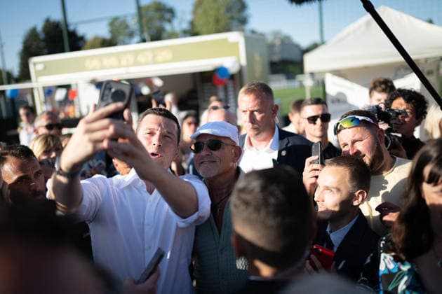 Marine Le Pen and Jordan Bardella at the RN party event La fete champetre - Lievin AJ President of French far-right party Rassemblement National (RN) Jordan Bardella takes a selfie with a supporter as he arrives during a RN party event La fete champetre in Lievin, northern France on July 4, 2026. Photo by Alexis Jumeau ABACAPRESS.COM. Paris France  Copyright: xJumeauxAlexis ABACAx