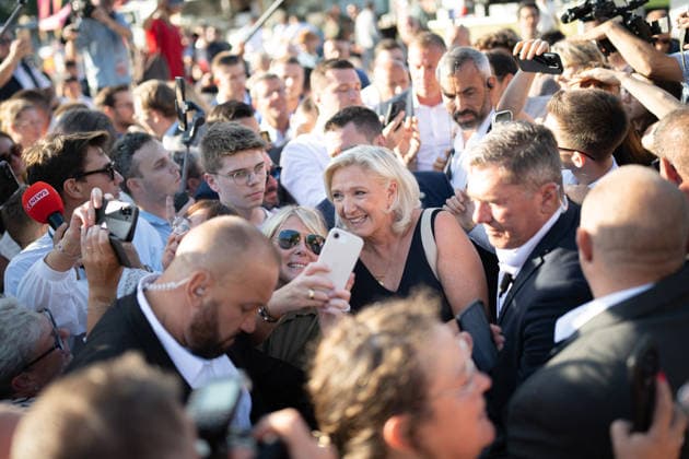 Marine Le Pen and Jordan Bardella at the RN party event La fete champetre - Lievin AJ President of Rassemblement National parliamentary group Marine Le Pen reacts and takes selfies with a supporter as she arrives during a RN party event La fete champetre in Lievin, northern France on July 4, 2026. Photo by Alexis Jumeau ABACAPRESS.COM. Paris France  Copyright: xJumeauxAlexis ABACAx