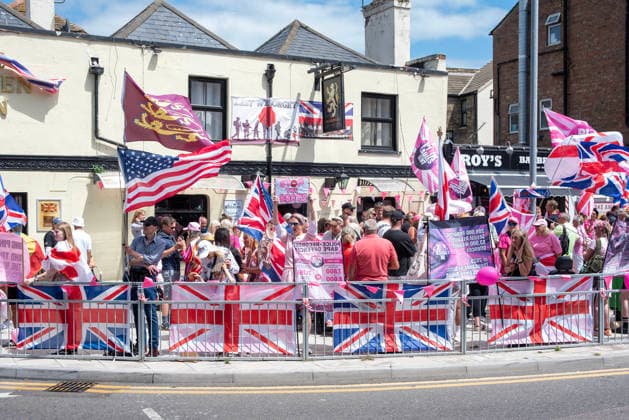 July 4, 2026, Dover, United Kingdom: Far-right protesters gather by the Golden Lion pub before a demonstration in Dover. Around 100-120 supporters of the Pink Ladies gathered from across the country in Dover, UK. The Pink Ladies is an anti immigration far-right movement. The far-right activists marched through central Dover to the Immigration Centre and they were confronted by a small group of antifascist counter-protesters during their march. Dover United Kingdom - ZUMAs197 20260704_aaa_s197_225 Copyright: xKrisztianxElekx