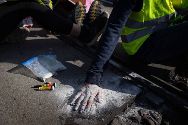 Protest against the federal party conference of the Alternative for Germany (AfD) in Erfurt - 04 Jul 2026 Protesters glue their hands to the asphalt to block a road during the demonstration against the federal party conference of the Alternative for Germany (AfD). The party’s two-day convention is being held at the Erfurt Exhibition Centre on July 4–5. According to police, around 31,000 people took part in the protests, while organizers estimated attendance at about 50,000. Demonstrators held marches, rallies and blockades of several access roads, including a section of the A71 motorway. Erfurt Germany Copyright: xVasilyxKrestyaninovx xSOPAxImagesx _VKR1092