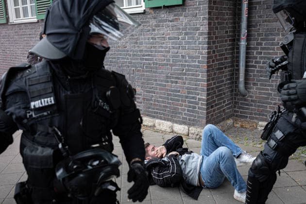 Protest against the federal party conference of the Alternative for Germany (AfD) in Erfurt - 04 Jul 2026 A journalist from Apollo News lies on the ground after being attacked during a protest against the federal party conference of the Alternative for Germany (AfD). The party’s two-day convention is being held at the Erfurt Exhibition Centre on July 4–5. According to police, around 31,000 people took part in the protests, while organizers estimated attendance at about 50,000. Demonstrators held marches, rallies and blockades of several access roads, including a section of the A71 motorway. Erfurt Germany Copyright: xVasilyxKrestyaninovx xSOPAxImagesx _VKR1691