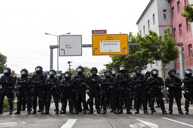Protest against the federal party conference of the Alternative for Germany (AfD) in Erfurt - 04 Jul 2026 Police officers stand in front of protesters blocking a road during the demonstration against the federal party conference of the Alternative for Germany (AfD). The party’s two-day convention is being held at the Erfurt Exhibition Centre on July 4–5. According to police, around 31,000 people took part in the protests, while organizers estimated attendance at about 50,000. Demonstrators held marches, rallies and blockades of several access roads, including a section of the A71 motorway. Erfurt Germany Copyright: xVasilyxKrestyaninovx xSOPAxImagesx _VKR1969