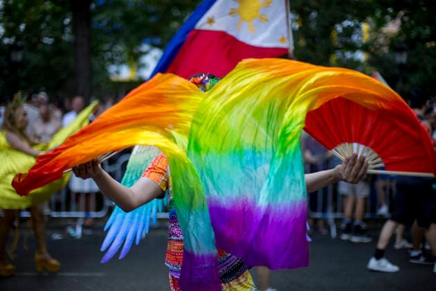 LGBTI+ Pride March in Madrid - 04 Jul 2026 A member of the Philippine community in Madrid waves fans with the colors of the LGBTQ+ flag during the 2026 LGBTI+ Pride March, under the slogan Take to the streets with pride! Dissent and resistance, along the Paseo del Prado in Madrid. Madrid Spain Copyright: xLuisxSotox xSOPAxImagesx LSOTOMLGTBI02