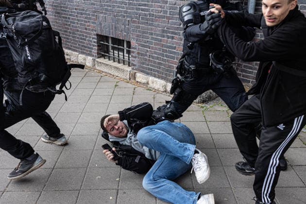 July 4, 2026, Erfurt, Germany: Police officers attempt to protect an Apollo News journalist as he is assaulted by left-wing activists during a protest against the federal party conference of the Alternative for Germany (AfD). The party™s two-day convention is being held at the Erfurt Exhibition Centre on July 4 5. According to police, around 31,000 people took part in the protests, while organizers estimated attendance at about 50,000. Demonstrators held marches, rallies and blockades of several access roads, including a section of the A71 motorway. Erfurt Germany  - ZUMAs197 20260704_aaa_s197_267 Copyright: xVasilyxKrestyaninovx