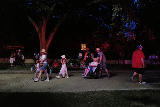 July 4, 2026, Washington, District Of Columbia, USA: A man advertises religious beliefs in Washington, D.C. on July 4, 2026, as crowds exit after the Freedom 250 Independence Day celebration on the National Mall was evacuated and portions of the event delayed to to incoming thunderstorms. Washington USA - ZUMAd227 20260704_znp_d227_017 Copyright: xBryanxDozierx