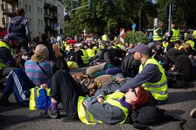 July 4, 2026, Erfurt, Germany: A protester lies on a road while blocking traffic during the demonstration against the federal party conference of the Alternative for Germany (AfD). The party™s two-day convention is being held at the Erfurt Exhibition Centre on July 4 5. According to police, around 31,000 people took part in the protests, while organizers estimated attendance at about 50,000. Demonstrators held marches, rallies and blockades of several access roads, including a section of the A71 motorway. Erfurt Germany - ZUMAs197 20260704_aaa_s197_255 Copyright: xVasilyxKrestyaninovx
