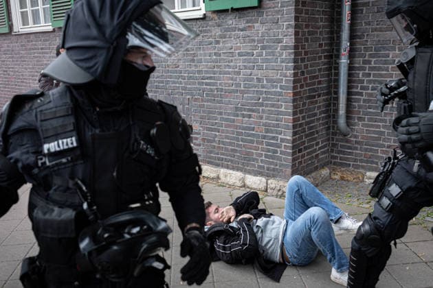 July 4, 2026, Erfurt, Germany: A journalist from Apollo News lies on the ground after being attacked during a protest against the federal party conference of the Alternative for Germany (AfD). The party™s two-day convention is being held at the Erfurt Exhibition Centre on July 4 5. According to police, around 31,000 people took part in the protests, while organizers estimated attendance at about 50,000. Demonstrators held marches, rallies and blockades of several access roads, including a section of the A71 motorway. Erfurt Germany - ZUMAs197 20260704_aaa_s197_260 Copyright: xVasilyxKrestyaninovx