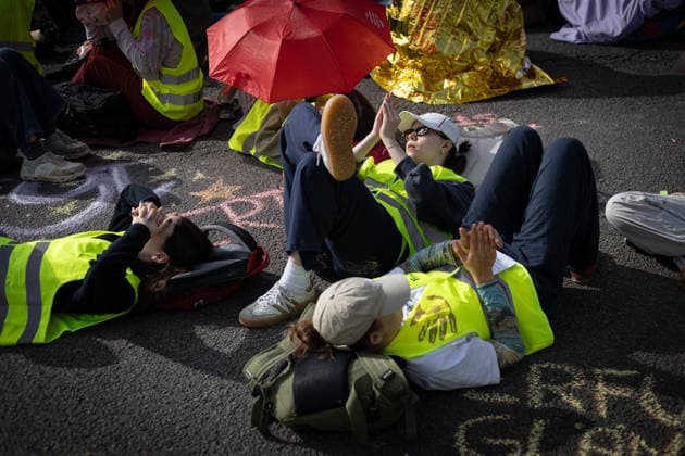 July 4, 2026, Erfurt, Germany: Protesters rest beside a road during the demonstration against the federal party conference of the Alternative for Germany (AfD). The party™s two-day convention is being held at the Erfurt Exhibition Centre on July 4 5. According to police, around 31,000 people took part in the protests, while organizers estimated attendance at about 50,000. Demonstrators held marches, rallies and blockades of several access roads, including a section of the A71 motorway. Erfurt Germany - ZUMAs197 20260704_aaa_s197_265 Copyright: xVasilyxKrestyaninovx