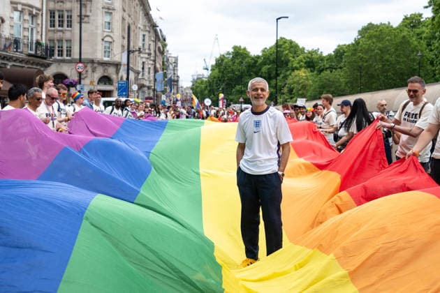 July 4, 2026, London, United Kingdom: London Mayor Sadiq Khan stands on LGBTQ+ flag during the parade. Participants take part in the annual Pride in London parade through central London, celebrating LGBTQ+ communities and advocating for visibility, unity and equality. Thousands of marchers, community groups, charities, businesses and campaign organisations join the procession, which travels through the capital with colourful costumes, banners, music and performances. London United Kingdom  - ZUMAs197 20260704_aaa_s197_289 Copyright: xAndreaxDomeniconix