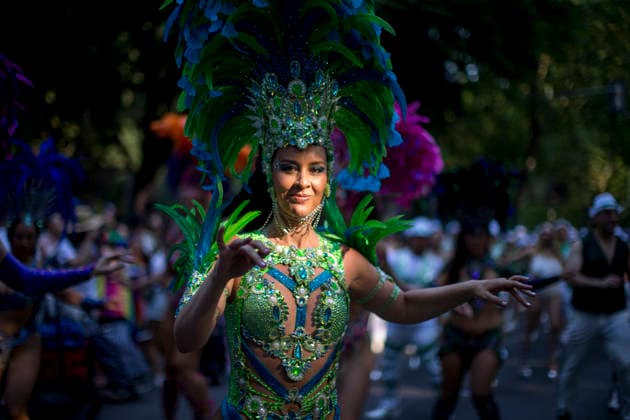 July 4, 2026, Madrid, Spain: A woman dances the samba during the 2026 LGBTI+ Pride March, under the slogan Take to the streets with pride! Dissent and resistance, along the Paseo del Prado in Madrid. Madrid Spain - ZUMAs197 20260704_aaa_s197_275 Copyright: xLuisxSotox