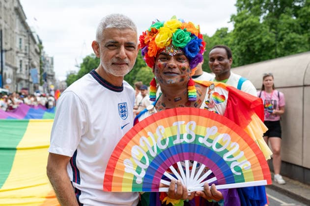 July 4, 2026, London, United Kingdom: London Mayor Sadiq Khan poses for photographs with a participant during the Pride in London parade in central London. Participants take part in the annual Pride in London parade through central London, celebrating LGBTQ+ communities and advocating for visibility, unity and equality. Thousands of marchers, community groups, charities, businesses and campaign organisations join the procession, which travels through the capital with colourful costumes, banners, music and performances. London United Kingdom - ZUMAs197 20260704_aaa_s197_290 Copyright: xAndreaxDomeniconix