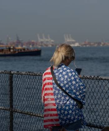 RECORD DATE NOT STATED New York Harbor Comes Alive as Sail250 Tall Ships Parade Marks America™s 250th Birthday (NEW) New York Harbor Comes Alive as Sail250 Tall Ships Parade Marks America™s 250th Birthday. July 04,2026, New York,USA. A spectator dressed in an American flag themed outfit waits for the Sail250 Tall Ship Parade to begin during the Fourth of July celebration of America™s 250th anniversary in New York Harbor.Credit: Jorge Estrellado Thenews2(Foto: Jorge Estrellado Thenews2 imago images) New York Harbor Comes Alive as Sail250 Tall Ships Parade Marks America™s 250th Birthday  Copyright: xJorgexEstrelladox