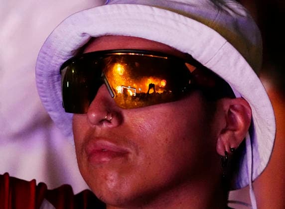 Fireworks are reflected in sunglasses as they light up the night sky over the National Mall as part of the America 250 celebrations in Washington DC on Saturday, July 4, 2026. The 35 minute July 4 fireworks show will feature 850,000 fireworks and pyrotechnic effects.  WAP20260704930 BONNIExCASH