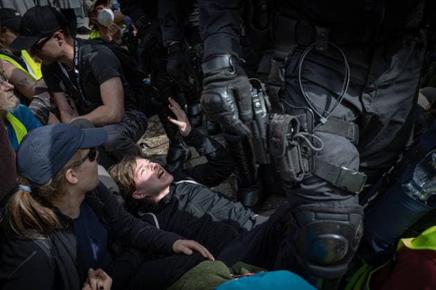 July 4, 2026, Erfurt, Germany: A protester lies on the ground next to a police officer during the demonstrations against the federal party conference of the Alternative for Germany (AfD). The party s two-day convention is being held at the Erfurt Exhibition Centre on July 4th and 5th. According to police, around 31,000 people took part in the protests, while organizers estimated attendance at about 50,000. Demonstrators held marches, rallies and blockades of several access roads, including a section of the A71 motorway. Erfurt Germany  - ZUMAs197 20260704_aaa_s197_256 Copyright: xVasilyxKrestyaninovx