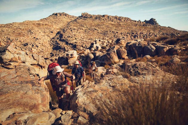 Hiker friends trekking together at Cederberg Mountains on sunny day model released, Symbolfoto, KOF00069